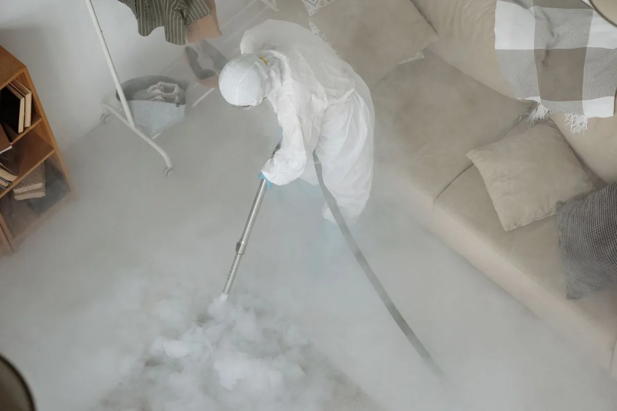 Biohazard cleanup technician in protective equipment, Sloan, IA